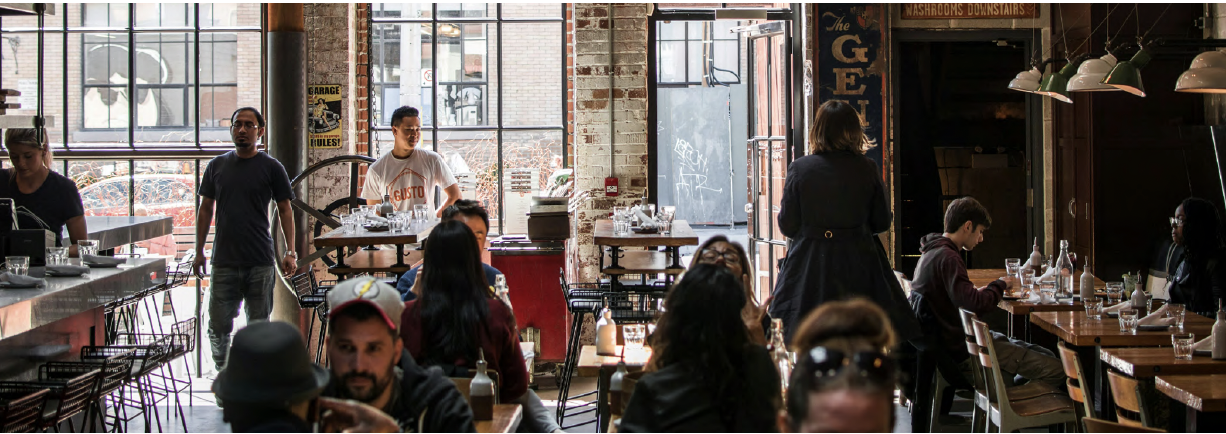 Busy coffee shop and cafe inside a restored brick warehouse